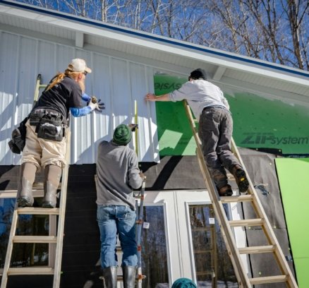 three person climbing on ladder