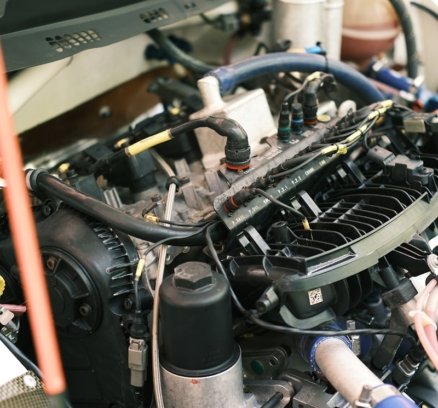 the engine compartment of a car with the hood open