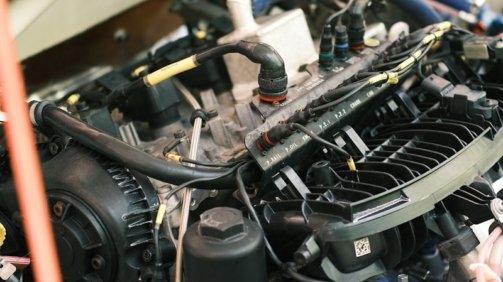 the engine compartment of a car with the hood open
